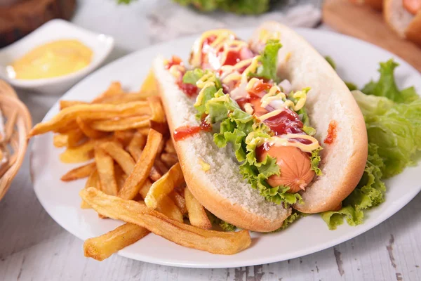 Hot dog with french fries — Stock Photo, Image