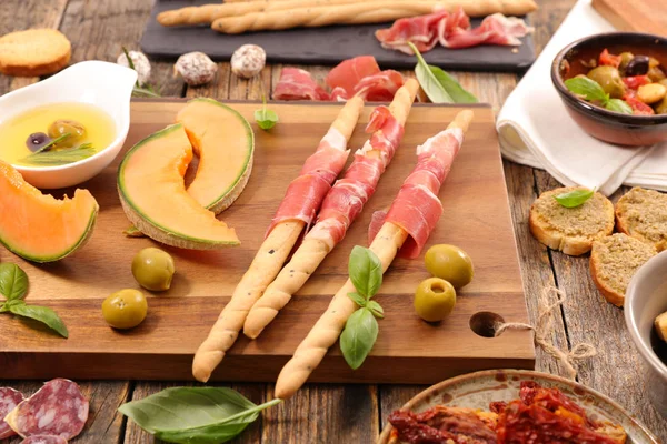 Antipasti with melon and ham — Stock Photo, Image