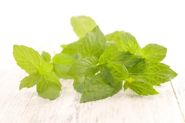 Mint leaves on table — Stock Photo, Image