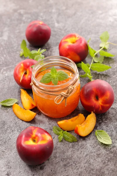 Peach jam in glass jar — Stock Photo, Image