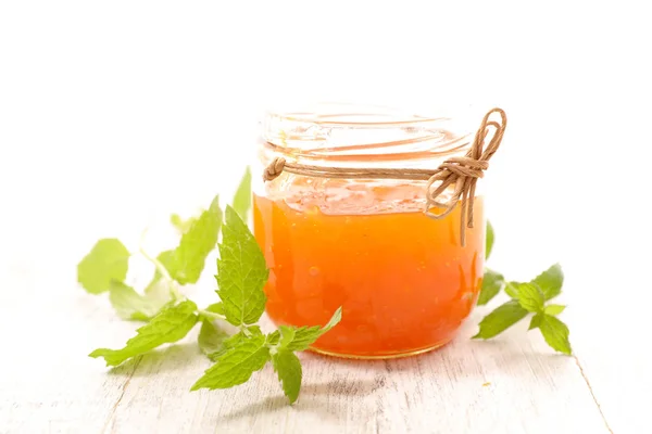 Fresh jam and mint leaves — Stock Photo, Image