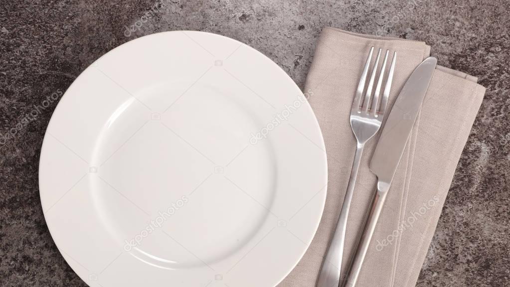 empty plate with cutlery