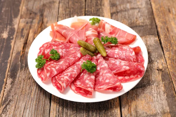 Plate of charcuterie on table — Stock Photo, Image