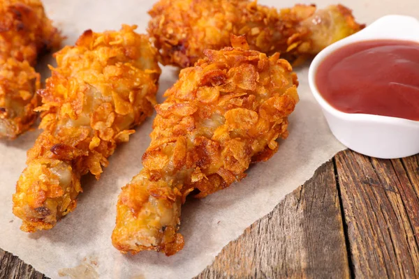 fried chicken legs  with ketchup