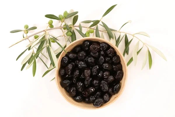 Black olives and branch — Stock Photo, Image