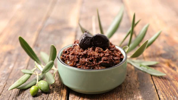 Tapenade with olive branches — Stock Photo, Image