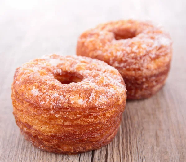 Sweet donuts on table — Stock Photo, Image