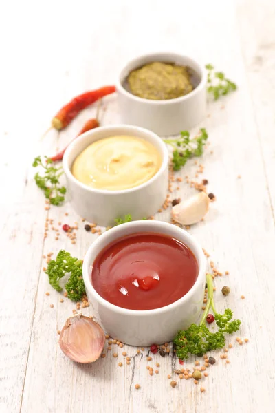 Sauces on wooden table — Stock Photo, Image