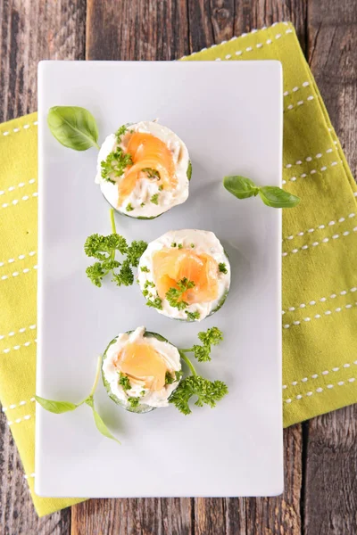 Cucumbers, cheese and salmon — Stock Photo, Image