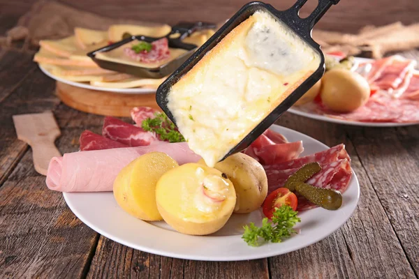 Cheese melted on potatoes — Stock Photo, Image
