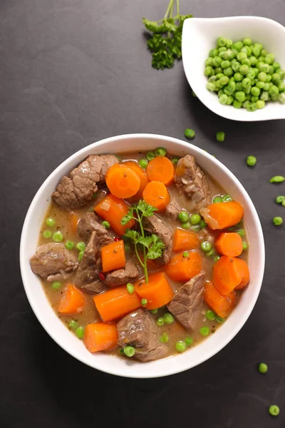 beef, carrots and peas dish