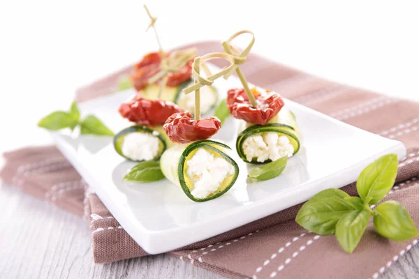 Cucmbers, cheese and dried tomatoes — Stock Photo, Image