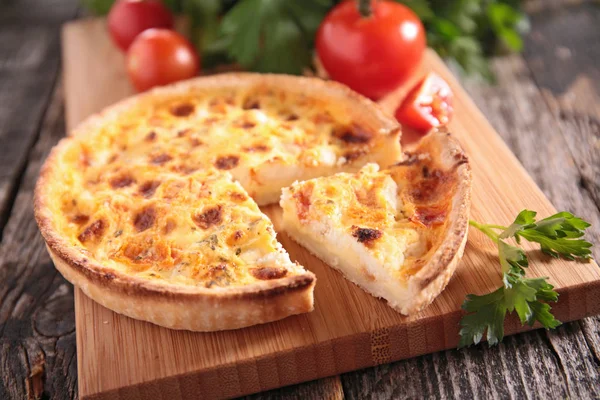 Quiche on wooden board — Stock Photo, Image