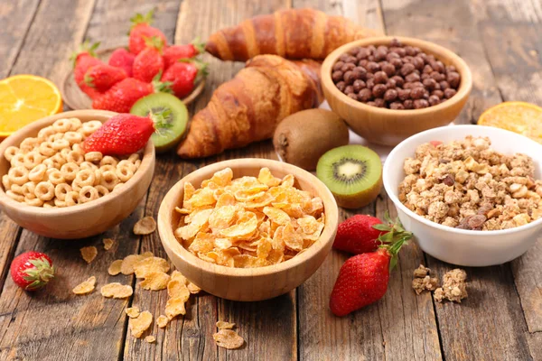 Breakfast with different flakes and fruits — Stock Photo, Image