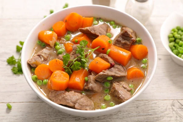 beef, carrots and peas dish