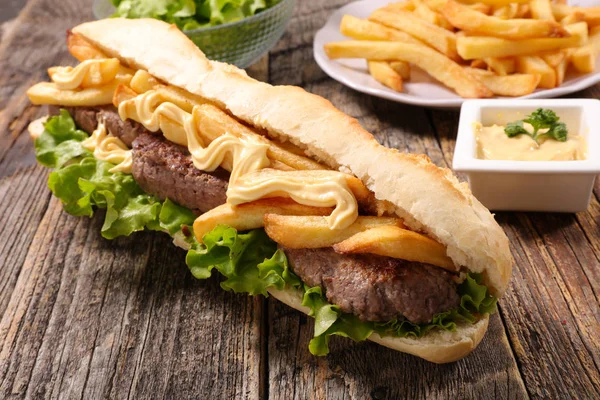 Sandwich with beef and french fries — Stock Photo, Image