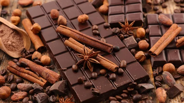 Assorted chocolate and spices — Stock Photo, Image