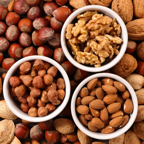 Bowls with assorted nuts — Stock Photo, Image