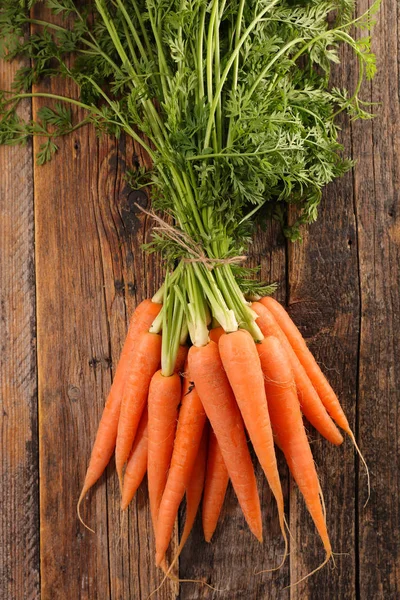 Carrots  wooden background — Stock Photo, Image