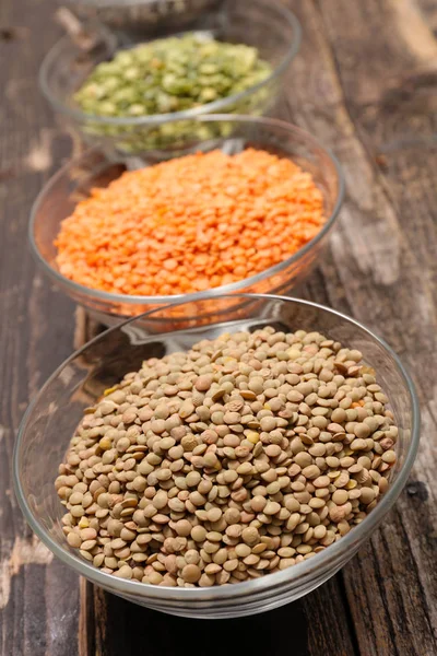 Assorted lentils in glass bowls — Stock Photo, Image