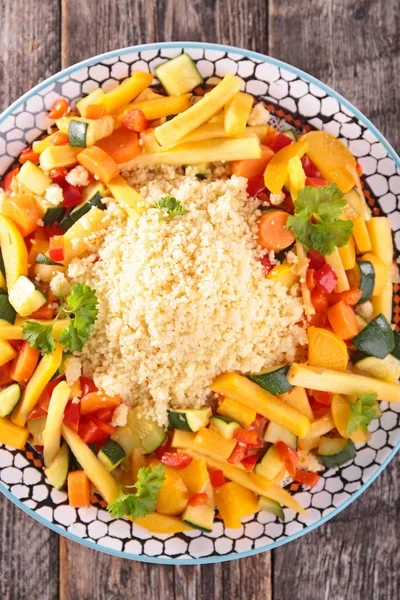 Couscous with vegetables on table — Stock Photo, Image