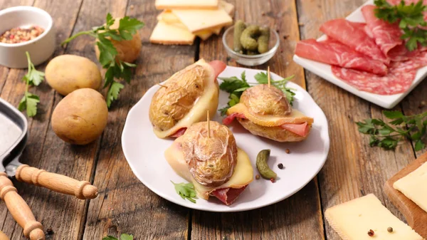 baked potatoes with ham and raclette cheese