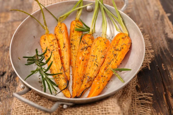 Roasted carrots on table — Stock Photo, Image