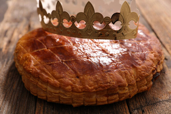 epiphany cake and crown on wooden table 