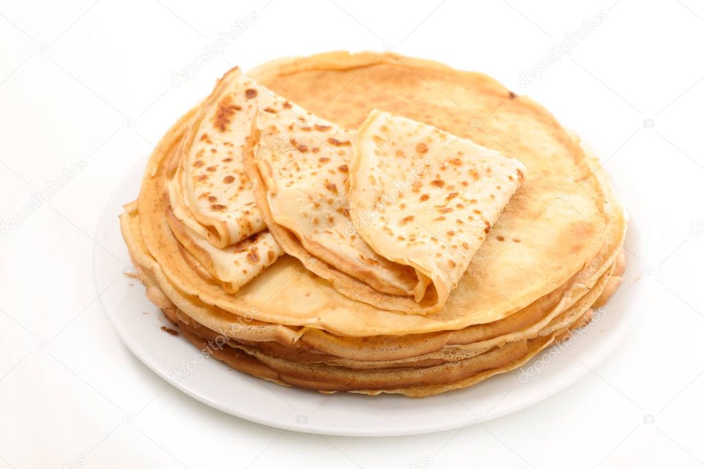 Close-up view ofstacked pancakes isolated on white 