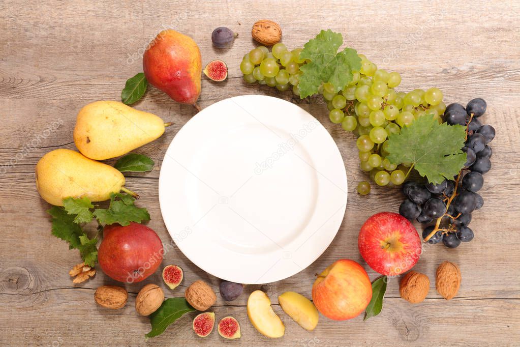 white plate and health food on wooden table