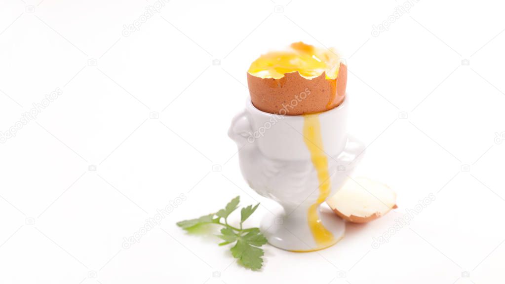 soft-boiled egg in eggcup isolated on white background