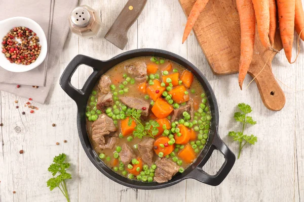 beef stewed with peas and carrot, top view