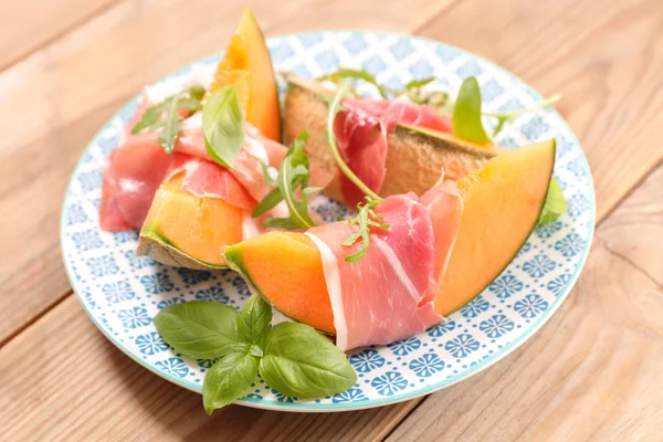 Melon Pieces Prosciutto Plate Wooden Table — Stock Photo, Image