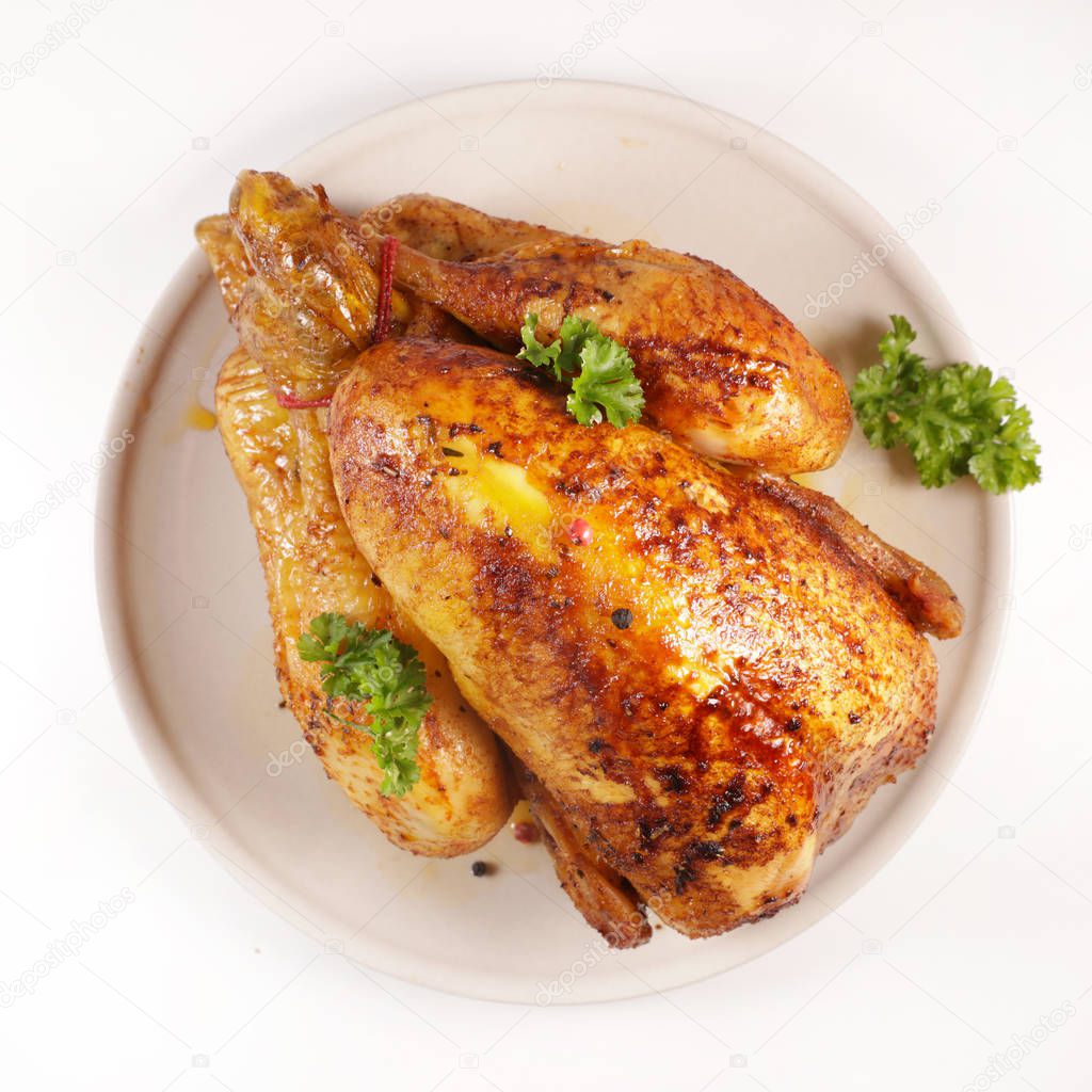 baked chicken and herb isolated on white background