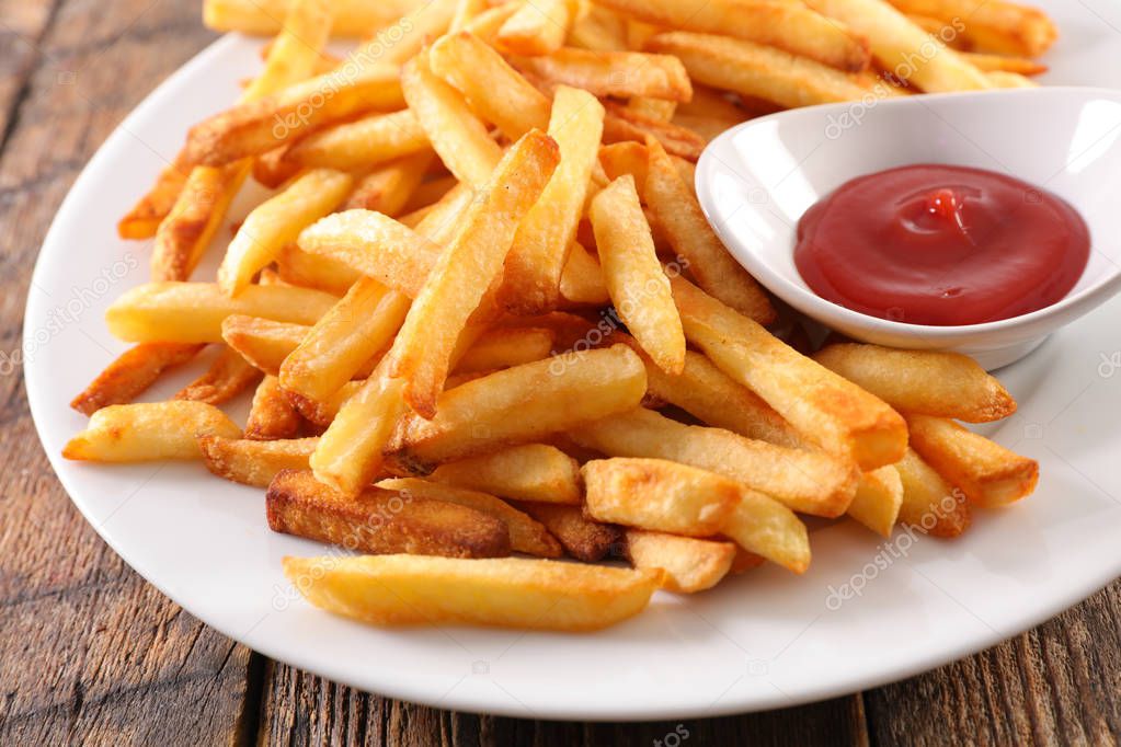 french fries and ketchup on plate