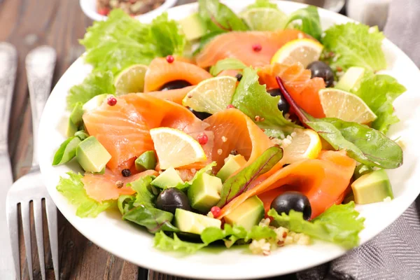 salad with salmon, avocado and olive