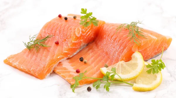 raw fish, salmon fillet with dill and lemon