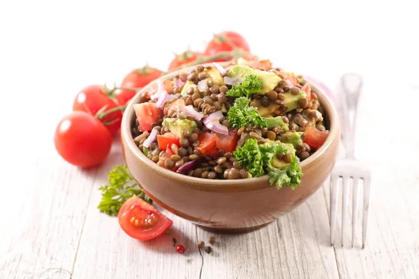 lentils salad with onion, tomato and sauce