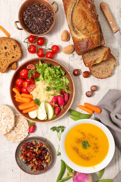 vegan dish assortment with soup, vegan bread and salad