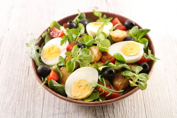 vegetable salad with egg, potato,tomato and olive