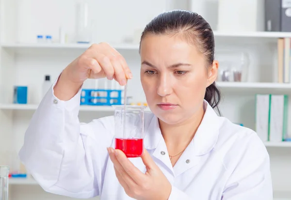 Young female scientist in lab , doing experiments in lab.