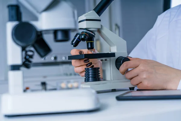 Laboratory assistant in the laboratory of of food quality.Cell culture assay.