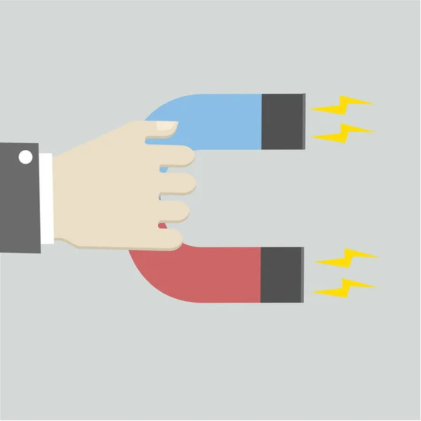 Hand holding magneet — Stockvector