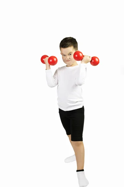 Boy doing exercises with dumbbells — Stock Photo, Image