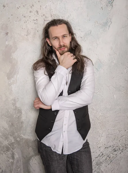 Portrait of handsome man with beard and long hair — Stock Photo, Image