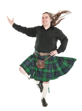 Scottish man in traditional national costume with blowing kilt  clipart