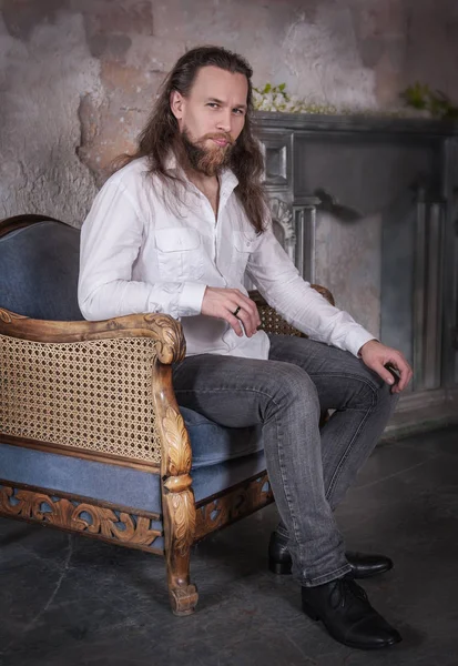 Portrait of handsome man with beard and long hair — Stock Photo, Image