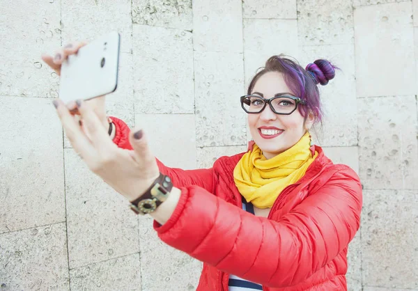 Fashion hipster woman with colorful hair taking picture of herse — Stock Photo, Image