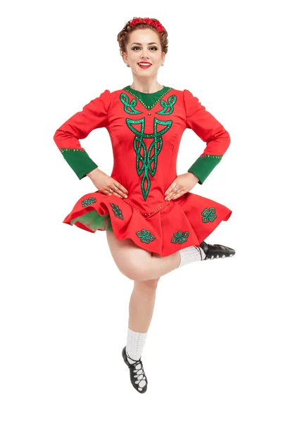 Beautiful woman in red dress for Irish dance jumping isolated — Stock Photo, Image