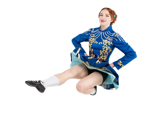 Beautiful woman in dress for Irish dance jumping isolated — Stock Photo, Image